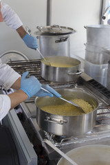 Stirring risotto milanese