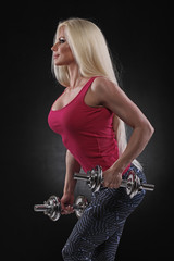 beautiful sporty  woman working out with dumbbells