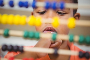 Student using a maths abacus
