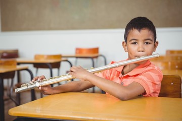 Student using a flute in class © WavebreakmediaMicro