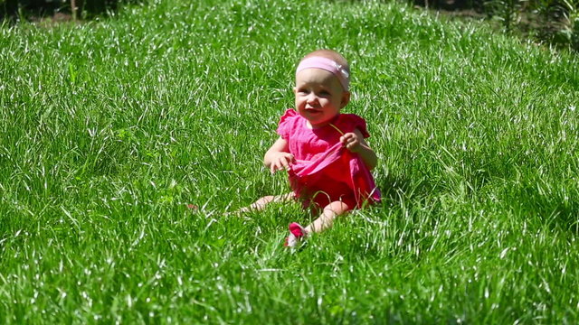 Baby girl on a grass