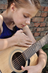Fototapeta premium young teenage girl with guitar