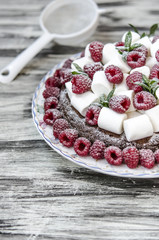 Oatmeal cake with marshmallow and raspberry  