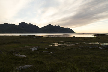 three elements in a landscape, sky, earth and water in lofoten on an evening 