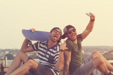 Couple of guys doing a selfie.