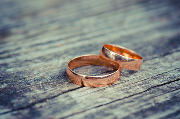 Wedding rings on a wooden board