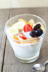 Brunch : glass of home made yogurt with cereals, strawberry, ban