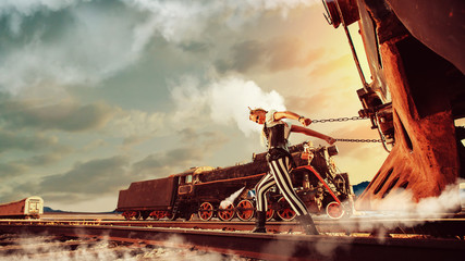 Blond woman in steampunk clothes is pulling a retro train. Anoth