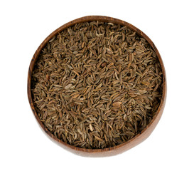 dried cumin in a wooden bowl