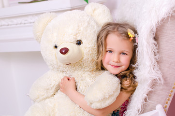 little cute girl with big white teddy bear
