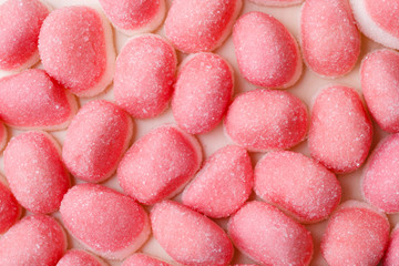 Pink jellies or marshmallows as background