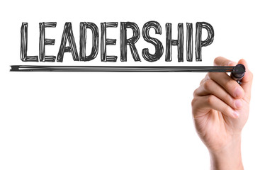 Hand with marker writing the word Leadership