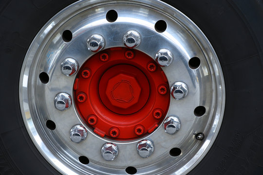 Red Center Wheel Of A Truck With Chrome Rim,nuts And Bolts