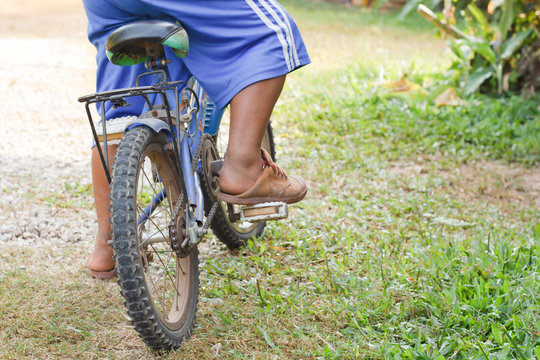 The Boy Foot On Pedal Of Bicycle