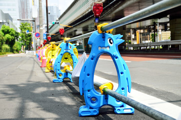 Penguin-shaped post of barricade at construction site, Japan