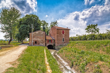 Country mill along dry river