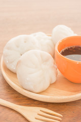 Fototapeta na wymiar Steamed dumpling stuff on wooden plate