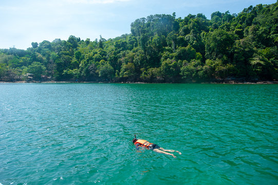 Travelers are swimming and snorkeling in Andaman sea