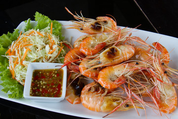 Shrimps freshwater grilled on plate  with seafood sauce.