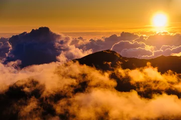 Zelfklevend Fotobehang Sunrise over clouds and distant mountains from Haleakala Crater. © Don Landwehrle