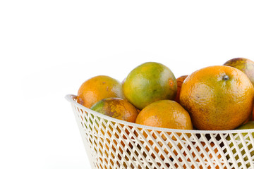orange fruit in basket, isolated on white background