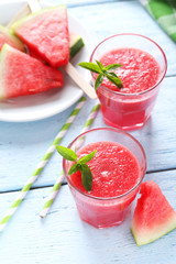 Fresh watermelon juice in the glass on wooden table