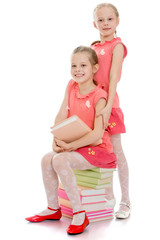 Charming sisters with books