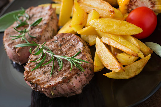 Tender and juicy veal steak medium rare with French fries