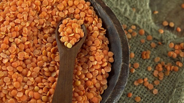 Heap of rotating red lentils (not loopable 4K footage)