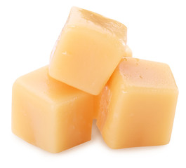 Sweet caramel candies on the white background.