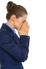 Closeup of tired businesswoman holding face in hands