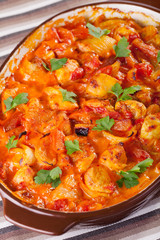 Casserole with chicken, potatos and tomatos