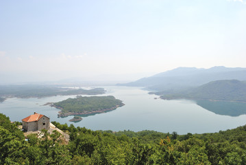 Fototapeta na wymiar Summer view of the Slansko Lake with islands near Niksic town, Montenegro