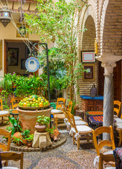 typical Andalusian courtyard decorated with flowers arches and cordoba spain