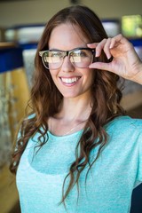 Pretty woman shopping for new glasses