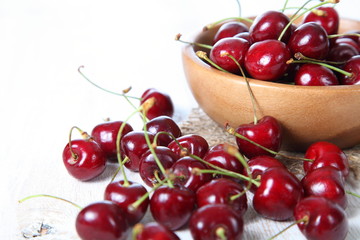 Ripe cherry in a wooden bowl