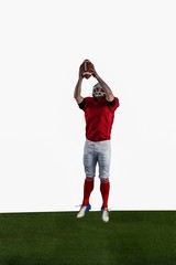 American football player catching football