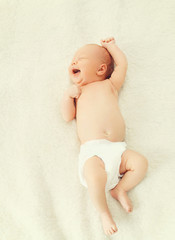 Portrait cute baby sleeping and yawning on the bed at home