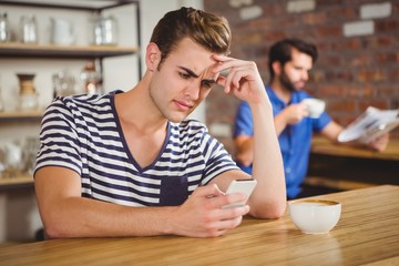 Worried man drinking a coffee