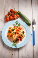 salmon with fresh tomatoes and zucchinis