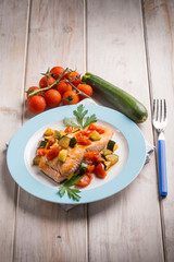 salmon with fresh tomatoes and zucchinis