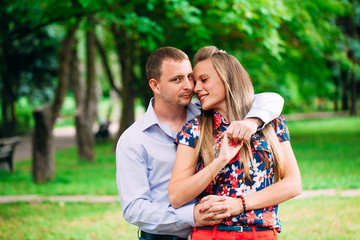 Happy young couple in love. Park outdoors.