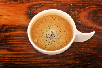 Coffee cup on wooden table.