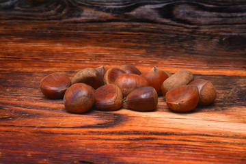 Chestnuts on wooden background