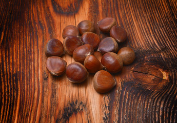 Chestnuts on wooden background