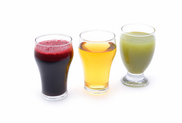 Fresh fruit and vegetable juices on white background