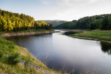 Picturesque summer landscape with dam
