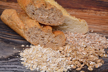 Bread and  grains on wooden background
