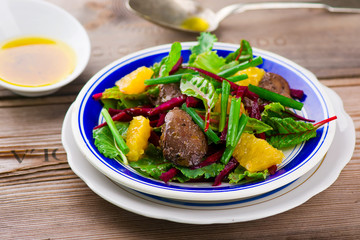 salad with beet and a chicken liver on