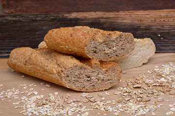 Bread and  grains on wooden background